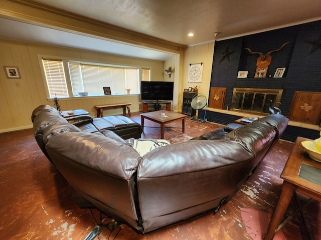 living room with crown molding, a fireplace, and beamed ceiling