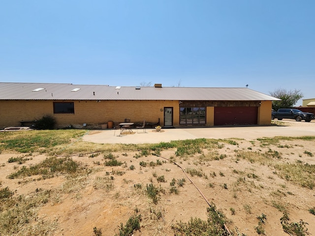 rear view of property with a patio area