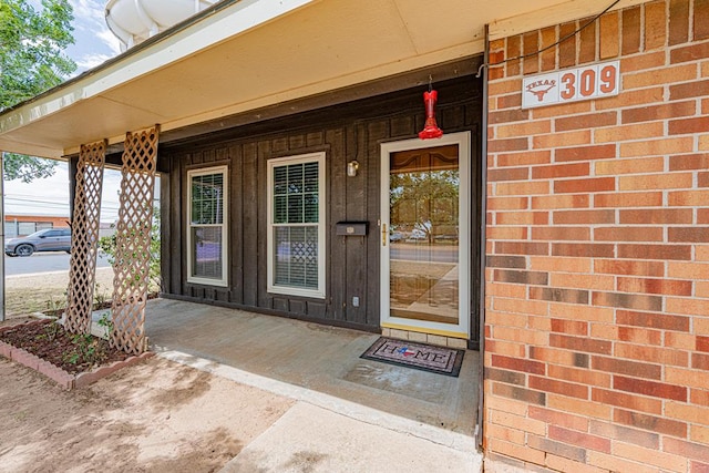 309 Edgewood Dr, Midland, TX 79703 - property entrance featuring covered porch and brick siding