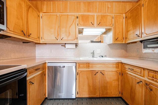 309 Edgewood Dr, Midland, TX 79703 - kitchen with stainless steel dishwasher, black range with electric cooktop, light countertops, and backsplash