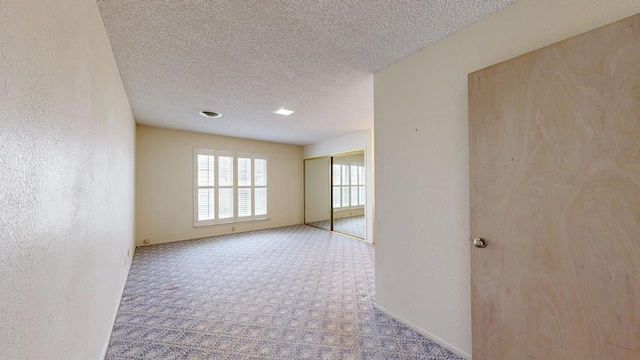 309 Edgewood Dr, Midland, TX 79703 - carpeted empty room featuring a textured ceiling
