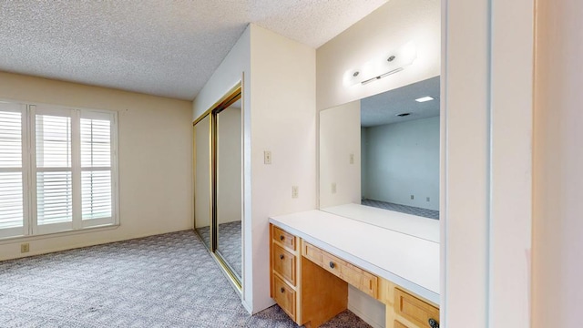 309 Edgewood Dr, Midland, TX 79703 - bathroom with a textured ceiling, vanity, and a shower