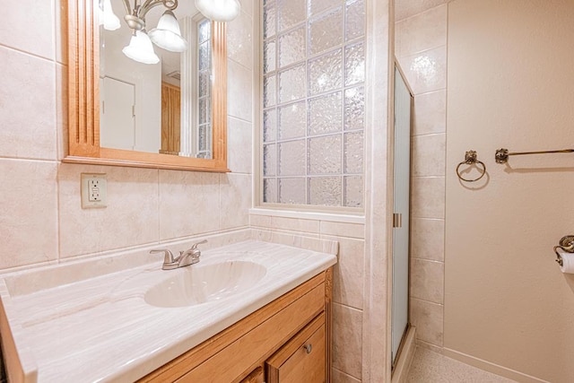 309 Edgewood Dr, Midland, TX 79703 - full bathroom with vanity, a shower stall, and a chandelier