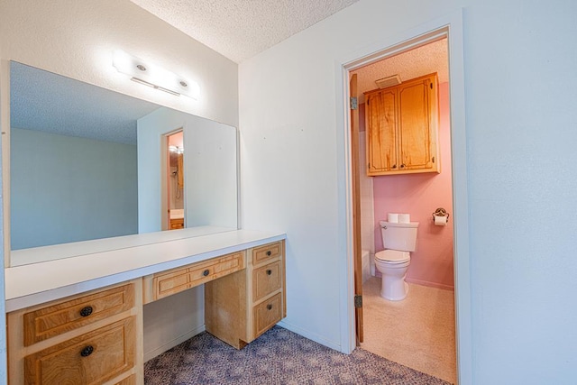 309 Edgewood Dr, Midland, TX 79703 - bathroom featuring a textured ceiling and vanity