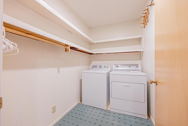 309 Edgewood Dr, Midland, TX 79703 - laundry area featuring separate washer and dryer and baseboards