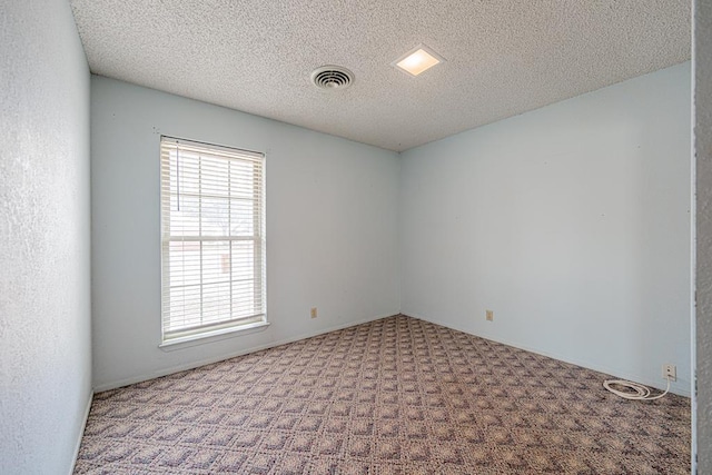 309 Edgewood Dr, Midland, TX 79703 - spare room with carpet and a textured ceiling