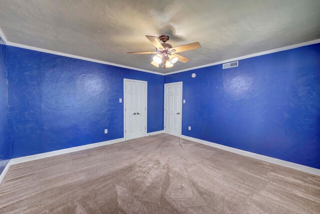 1600 W Kansas, Midland, TX 79701 - spare room with a ceiling fan, carpet flooring, baseboards, and crown molding