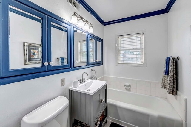 1600 W Kansas, Midland, TX 79701 - full bathroom featuring vanity, a garden tub, toilet, and ornamental molding