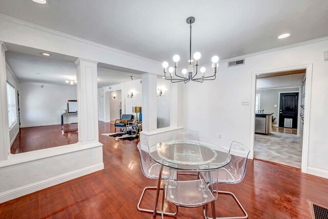 1600 W Kansas, Midland, TX 79701 - dining area with ornate columns, ornamental molding, wood finished floors, a chandelier, and baseboards