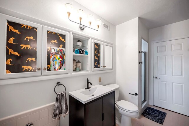 1600 W Kansas, Midland, TX 79701 - full bath featuring toilet, vanity, and a shower with door