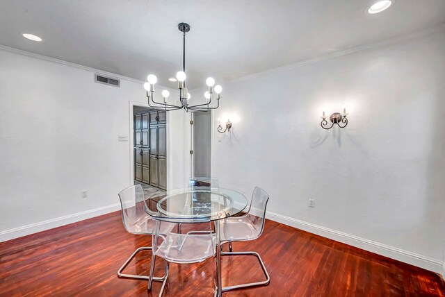 1600 W Kansas, Midland, TX 79701 - dining room with baseboards, wood finished floors, a chandelier, crown molding, and recessed lighting