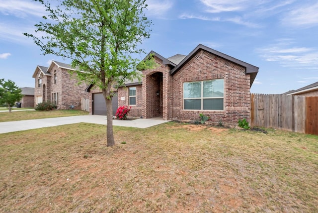 view of front facade featuring driveway, fence, brick siding, a garage, and a front yard