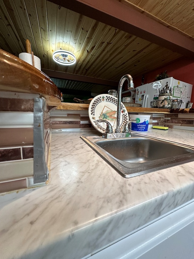 room details featuring wood ceiling and sink