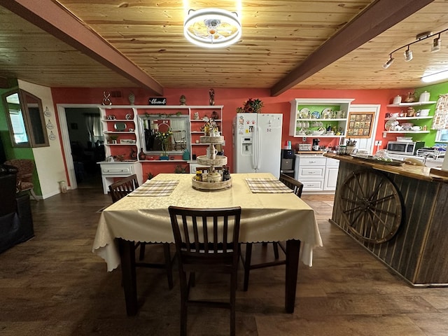 dining space featuring hardwood / wood-style flooring, beam ceiling, wooden ceiling, and track lighting