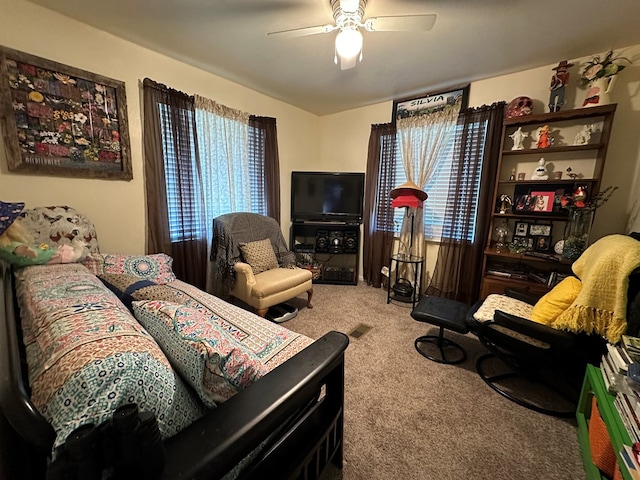 living room featuring light colored carpet and ceiling fan