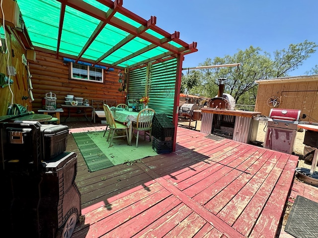 wooden terrace with a pergola