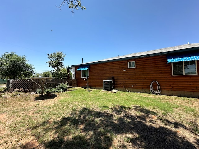 exterior space with a yard and central AC unit