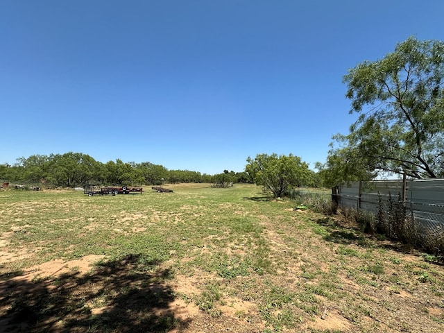 view of yard with a rural view