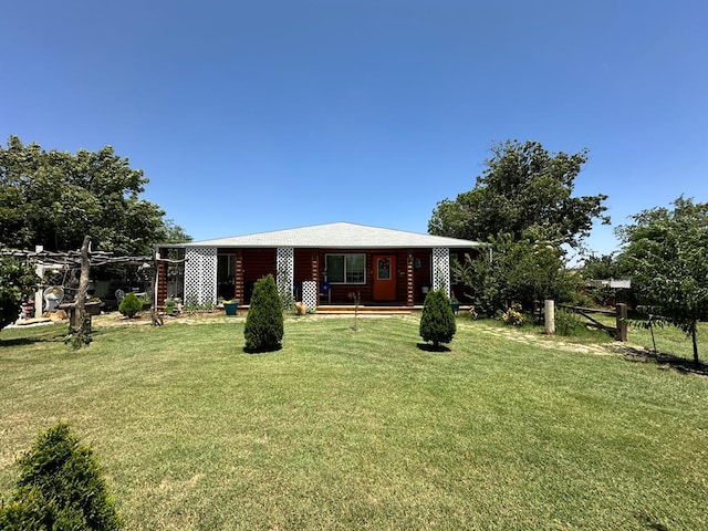 exterior space with a lawn and a porch