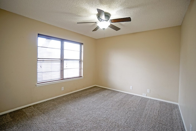 unfurnished room with ceiling fan, carpet floors, and a textured ceiling