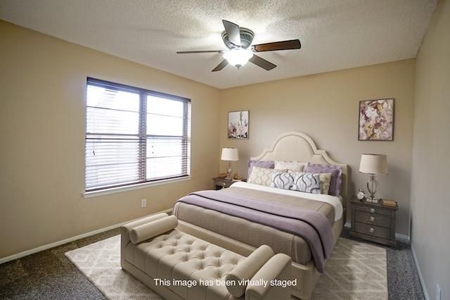 bedroom with carpet flooring, a textured ceiling, and ceiling fan