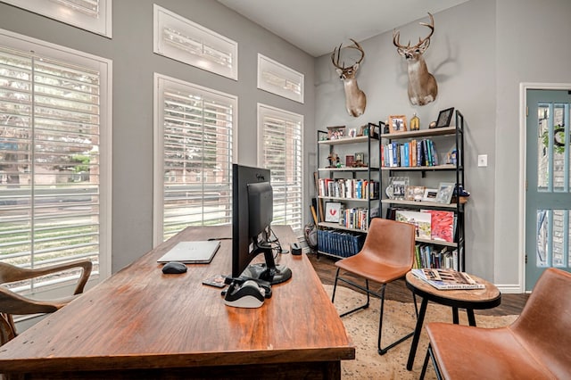 office with wood finished floors and a wealth of natural light