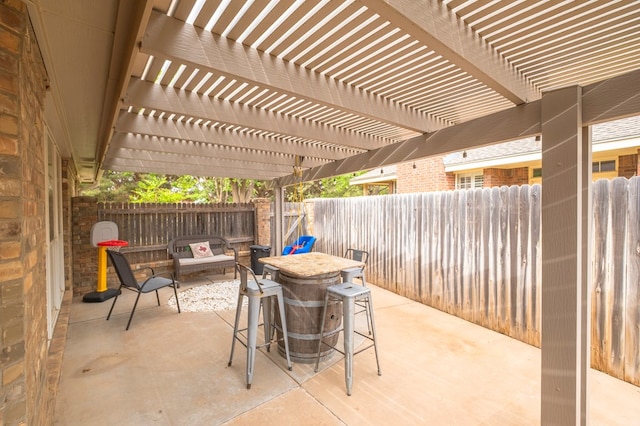 view of patio / terrace featuring a pergola and a fenced backyard
