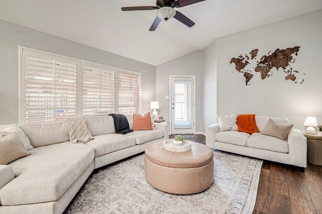 living room with a ceiling fan, dark wood-style floors, and lofted ceiling