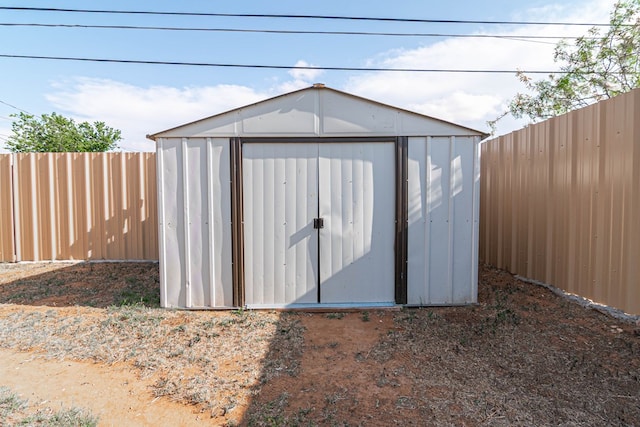 view of shed featuring a fenced backyard