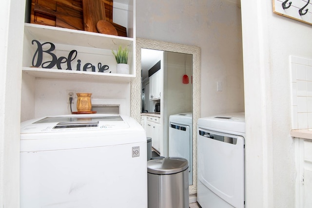 washroom with separate washer and dryer