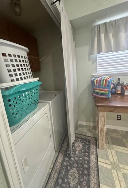 laundry area with washing machine and dryer