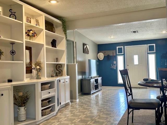 interior space with a textured ceiling