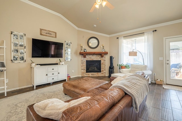 living room with dark hardwood / wood-style flooring, ornamental molding, ceiling fan, a fireplace, and lofted ceiling