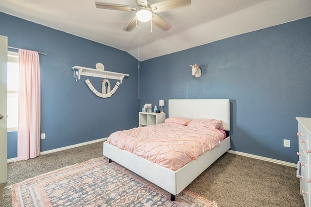 bedroom featuring ceiling fan, dark carpet, and vaulted ceiling