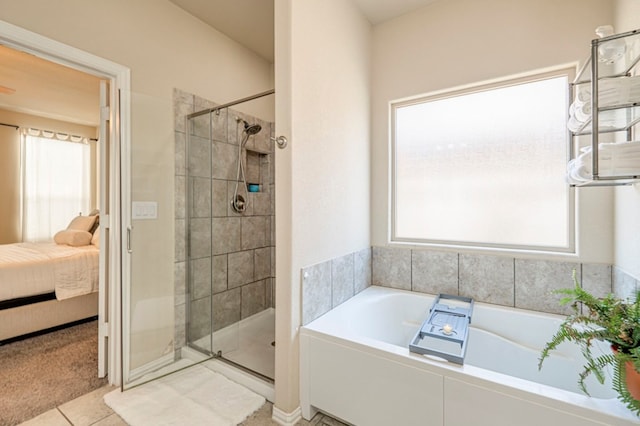 bathroom with plus walk in shower and tile patterned flooring