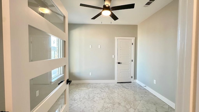 empty room featuring ceiling fan