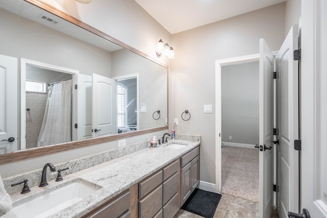 7604 Keyhaven, Odessa, TX 79765 - bathroom with double vanity and a shower with curtain