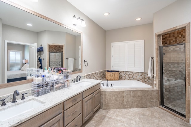 7604 Keyhaven, Odessa, TX 79765 - ensuite bathroom featuring a bath, a stall shower, double vanity, recessed lighting, and tile patterned floors