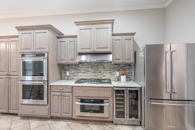 7604 Keyhaven, Odessa, TX 79765 - kitchen with appliances with stainless steel finishes, beverage cooler, under cabinet range hood, crown molding, and backsplash