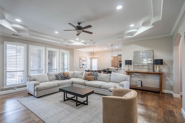 7604 Keyhaven, Odessa, TX 79765 - living area with crown molding, ceiling fan, a chandelier, wood finished floors, and a raised ceiling