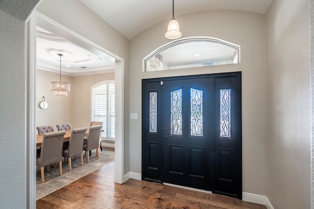 7604 Keyhaven, Odessa, TX 79765 - foyer entrance featuring wood finished floors and ornamental molding