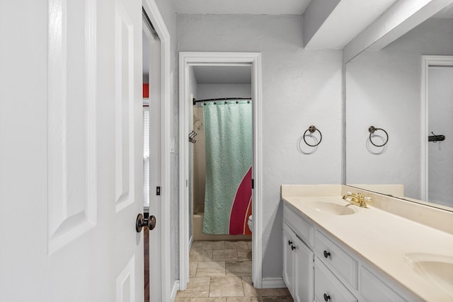 full bathroom featuring vanity, shower / bathtub combination with curtain, and toilet