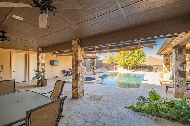 view of swimming pool with a fenced in pool, an outdoor kitchen, a patio area, an in ground hot tub, and a fenced backyard