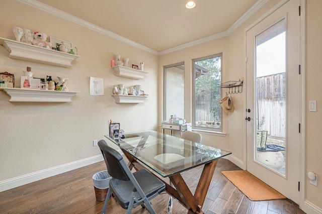 home office with dark wood-type flooring and ornamental molding