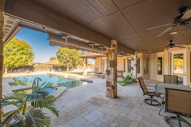 view of swimming pool with a fenced in pool, a ceiling fan, a patio, a fenced backyard, and outdoor dining space