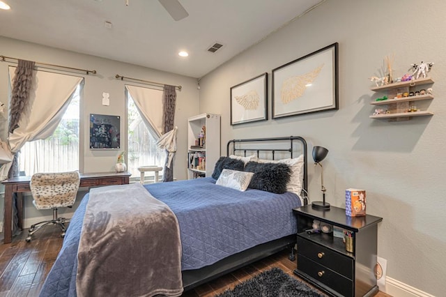 bedroom with dark hardwood / wood-style floors and ceiling fan