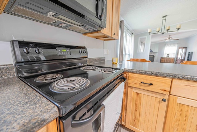 50031 E County Rd 71, Midland, TX 79705 - kitchen with electric range oven, ceiling fan, dark countertops, and plenty of natural light