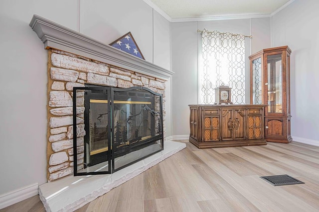 50031 E County Rd 71, Midland, TX 79705 - detailed view of a fireplace, wood finished floors, crown molding, and baseboards