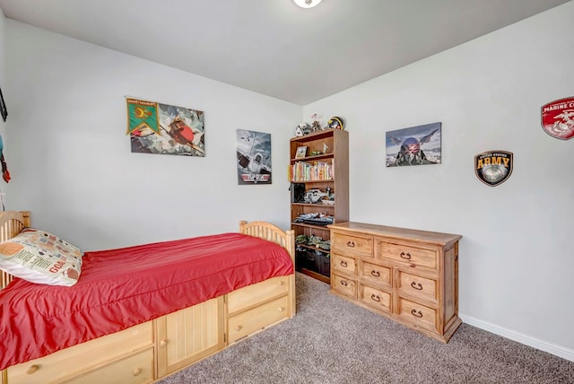 bedroom with carpet floors and baseboards