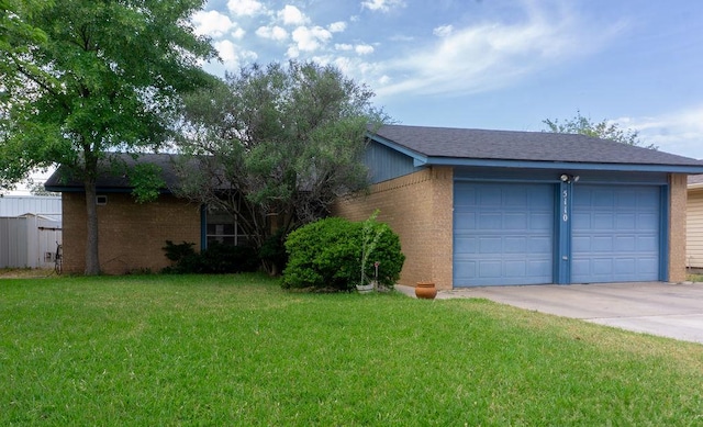 5110 Sunnyside Dr, Midland, TX 79703 - single story home with brick siding, driveway, a garage, and a front yard